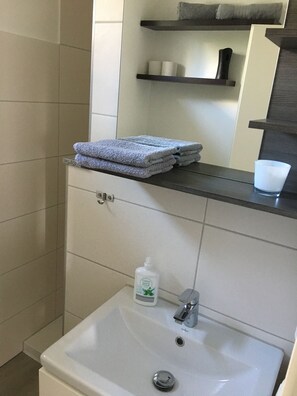 Hair dryer, towels, soap, toilet paper