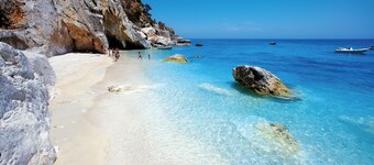Family room with mountain view terrace and window overlooking the harbor.