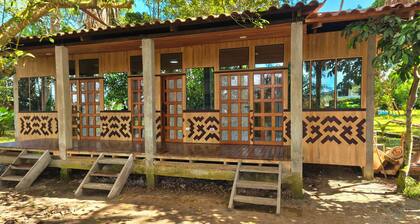Cabins and lake, abundant vegetation and wildlife in the heart of downtown Iquitos