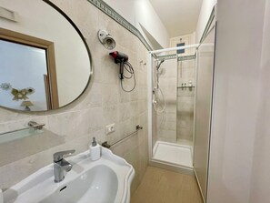Hair dryer, bidet, towels, soap