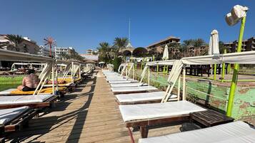 On the beach, free beach cabanas, 3 beach bars