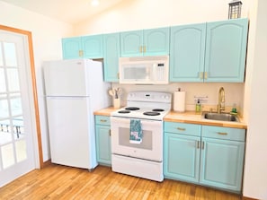 Microwave, stovetop, coffee/tea maker, cookware/dishes/utensils
