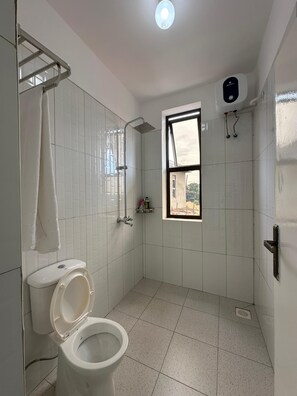 Shower, hair dryer, towels, soap