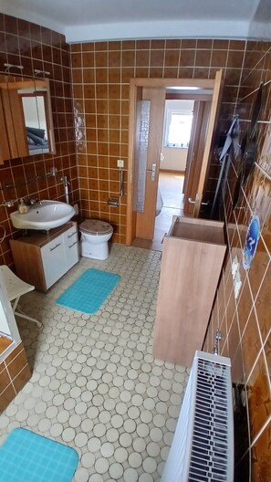 Shower, towels, soap, toilet paper