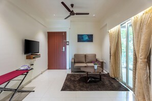 Suite estudio familiar, vistas a la ciudad | Sala de estar