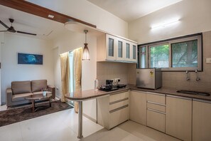 Suite estudio familiar, vistas a la ciudad | Instalaciones de cocina compartidas | Placa de cocina