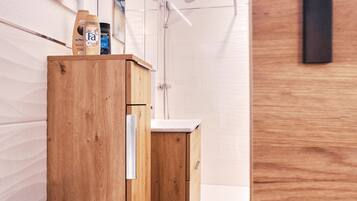 Shower, hair dryer, towels, toilet paper