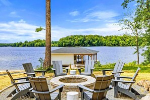 A lakeside deck with Adirondack chairs, a fire pit, and a small gazebo. - Lakefront Lake Anna, Beach, Dock, Deck Vie (Bumpass)