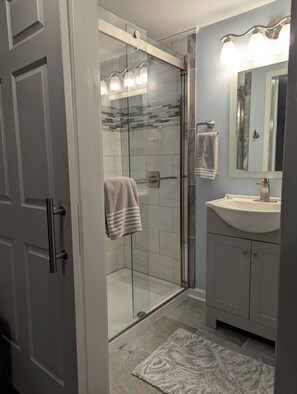 Shower, hair dryer, towels, soap