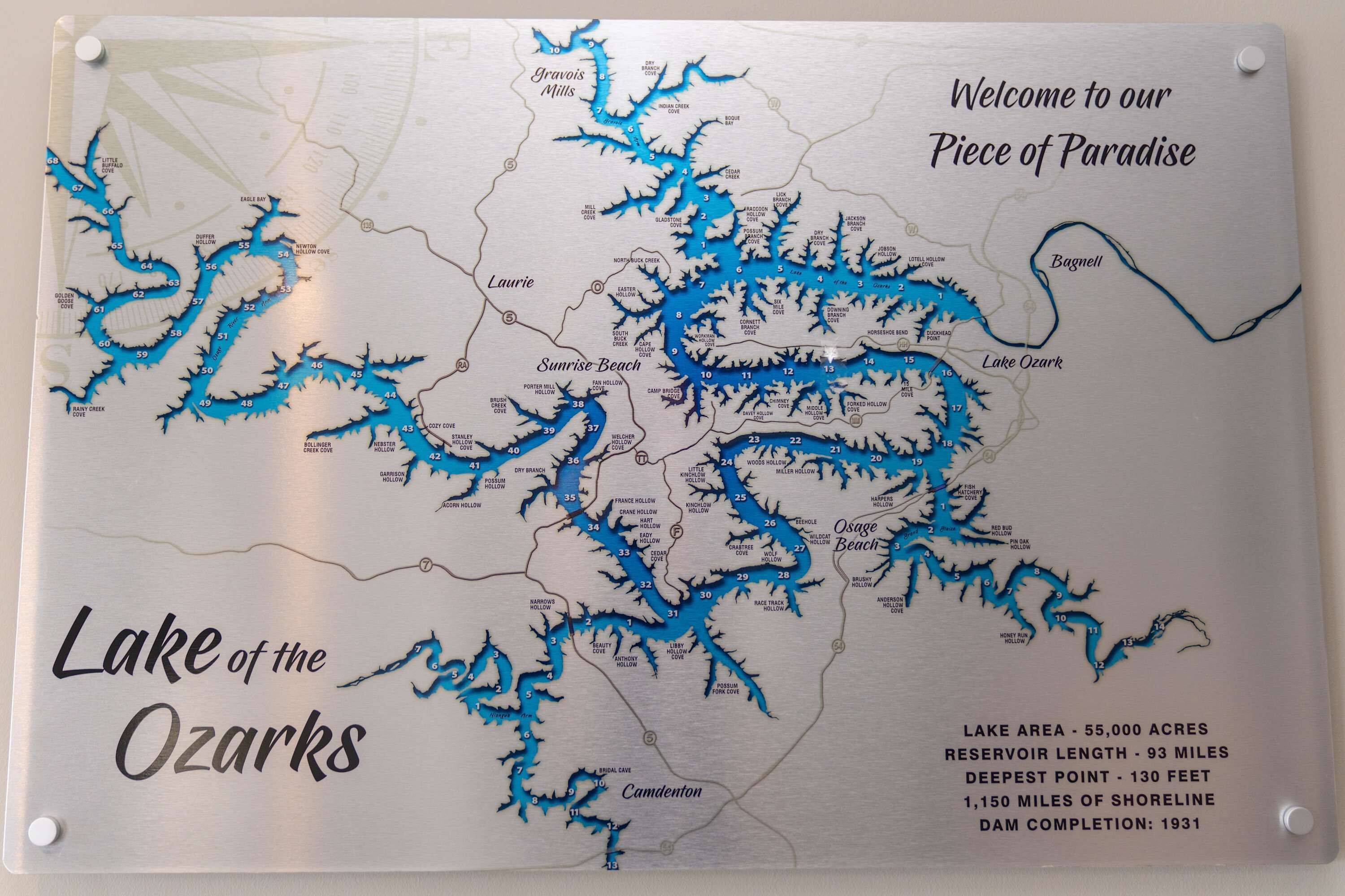 A detailed map of Lake of the Ozarks with various cove names and surrounding areas.