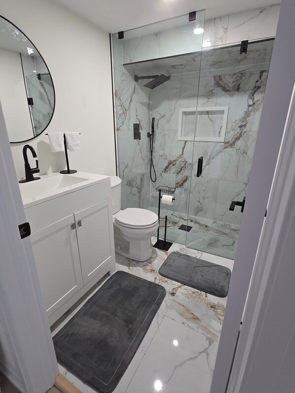 Shower, hair dryer, towels, soap