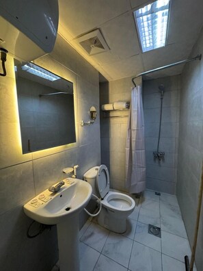 Shower, hair dryer, slippers, towels