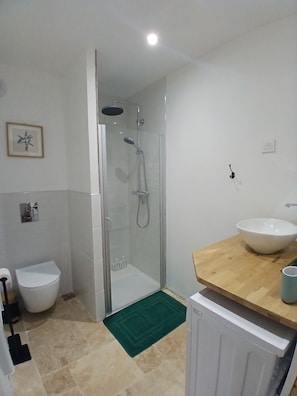Shower, hair dryer, towels, soap