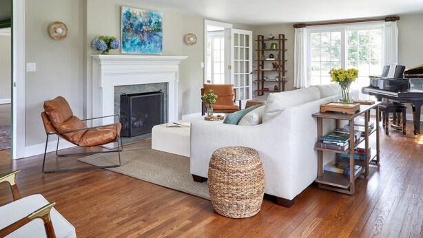 A living room with a fireplace, a piano, and a sofa. - The Kent Collection - The Firefly Inn (Kent)