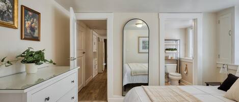 Full-length mirror, with the bathroom right off the bedroom.