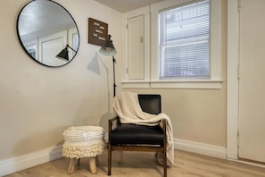 Reading chair and floor lamp by the window. - 1BR + Office & Parking - Near Downtown SJ, Tech & Hospitals (San Jose)