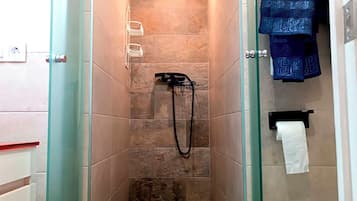 Shower, towels, soap, toilet paper