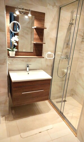 Shower, hair dryer, towels, soap