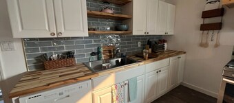 Minutes to downtown, right on the lake. Pet friendly home, sleeps 10 with views!