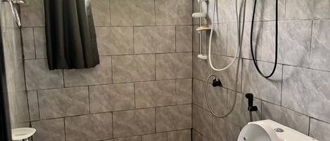 Shower, towels, soap, toilet paper