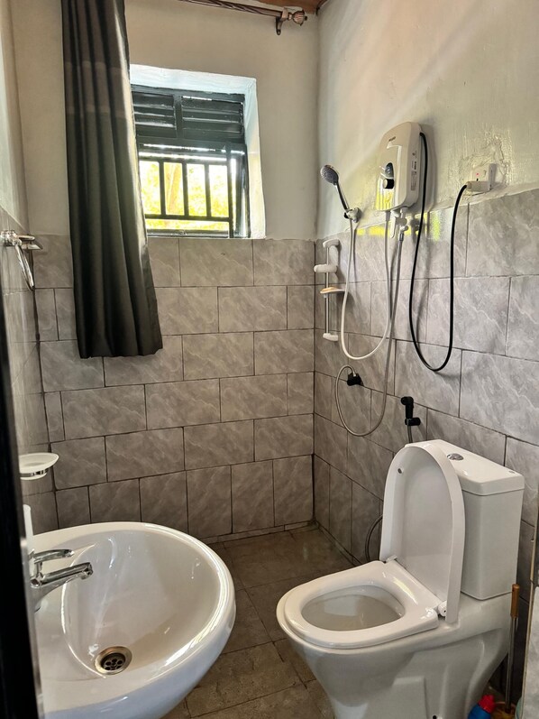 Shower, free toiletries, slippers, towels