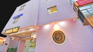 A hotel with multiple signs, including 'Hotel RJ' and 'Tab Hotels'. - Fabhotel Rj (Patna)