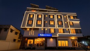 A modern hotel with a prominent 'fab hotels' sign, multiple floors, and a well-lit entrance. - Fabhotel The Grand Manmuralidhar (Jaipur)