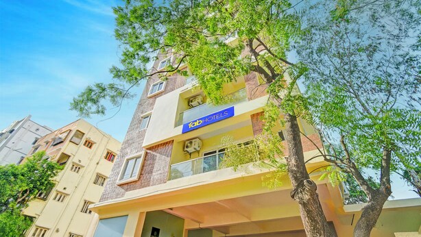 A multi-story hotel with a prominent 'TabHotels' sign, balconies, and a view of the surrounding buildings. - Fabhotel Legacy (Hyderabad)