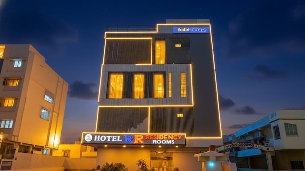 A modern hotel building with illuminated signage for 'fabHOTELS' and 'HOTEL RR RESIDENCY ROOMS'. - Fabhotel Rr Residency I (Khammam)
