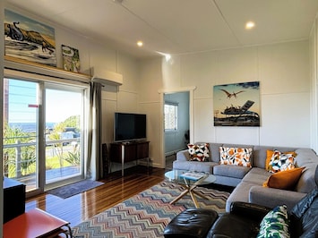 Large door to front deck plus louvered windows for the ocean breeze