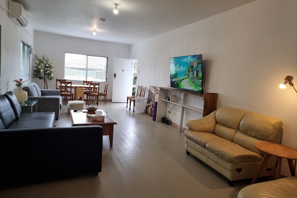 The living room is separate from the main sleeping areas.