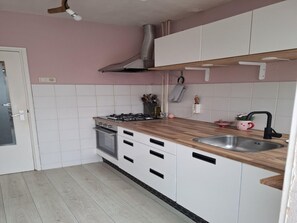 House | Private kitchen | Highchair - Holiday Home With Beautiful Garden (Heiloo)