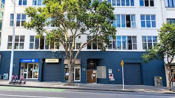 A multi-story building with a sign reading 'Oceanic Building.'