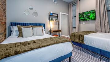 1 bedroom, desk, iron/ironing board, travel crib