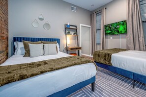 1 bedroom, desk, iron/ironing board, travel crib