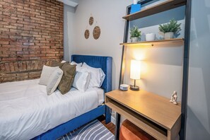 1 bedroom, desk, iron/ironing board, travel cot