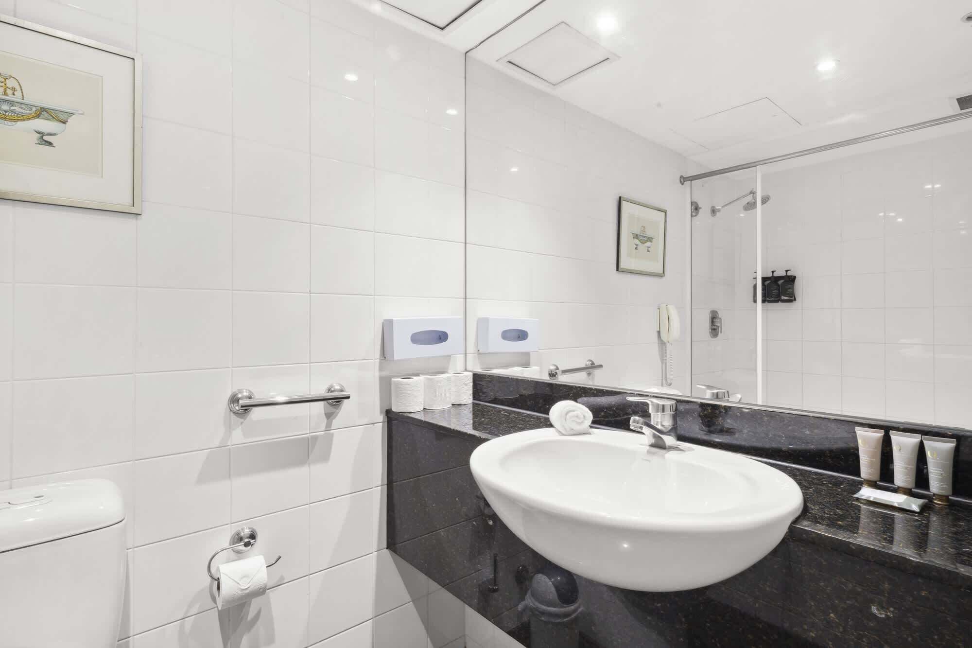 Shower, hair dryer, towels, shampoo