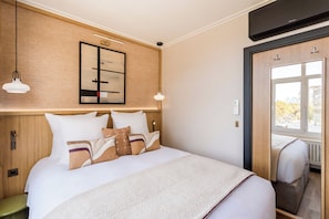Apartment, City View | Hypo-allergenic bedding, pillowtop beds, in-room safe