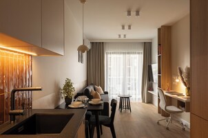 Apartment, 1 Bedroom, Balcony | Living area | 55-inch Smart TV with cable channels
