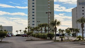 A hotel with a modern design, featuring a prominent 'Trends' sign on the building. - Tradewinds 603 (Orange Beach)