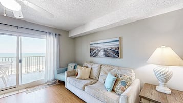 Signature Condo, Balcony, Beach View | Living room | 65-inch Smart TV with digital channels
