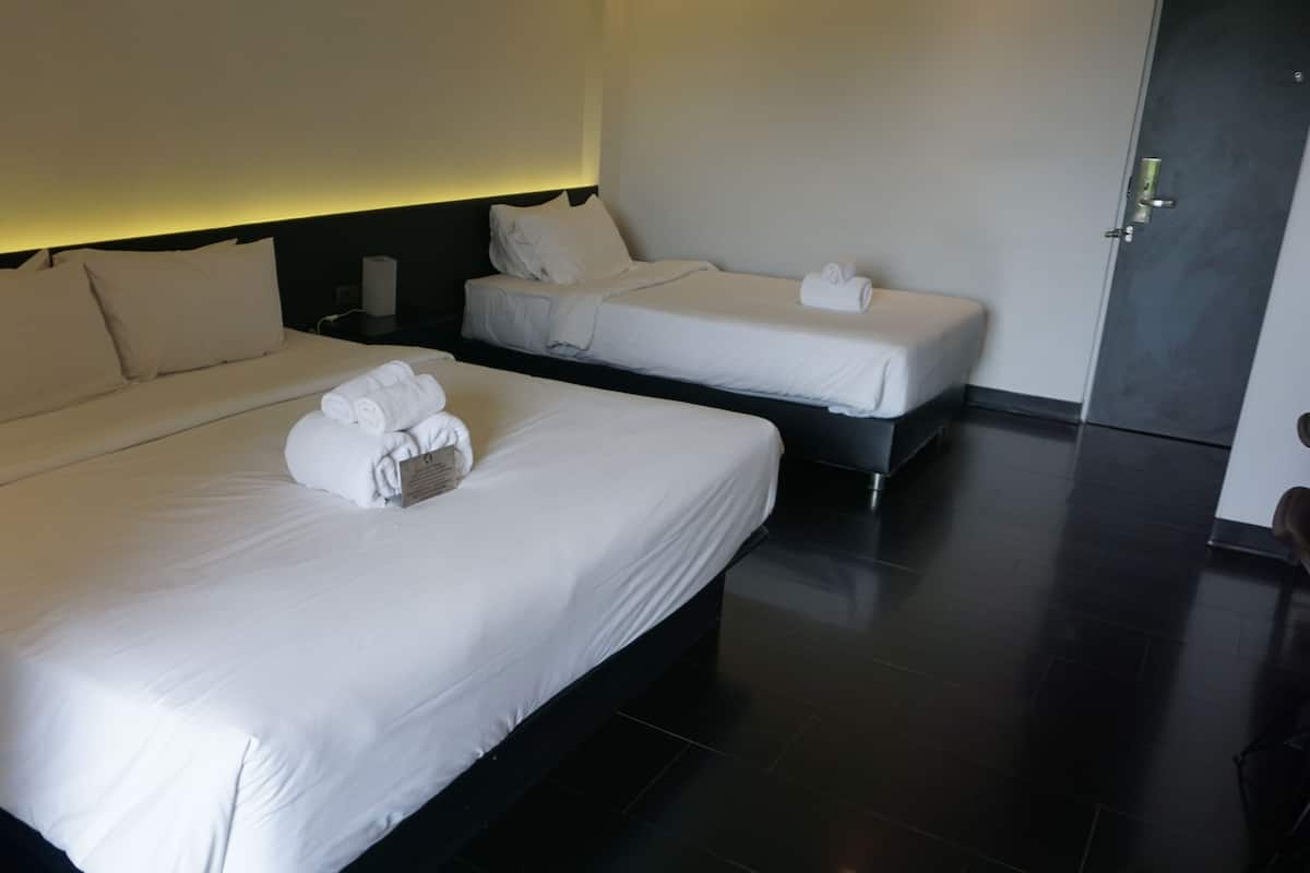 Standard Triple Room, Balcony, City View | Minibar, in-room safe, desk, blackout curtains