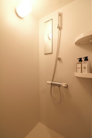 Shower, free toiletries, hair dryer, slippers