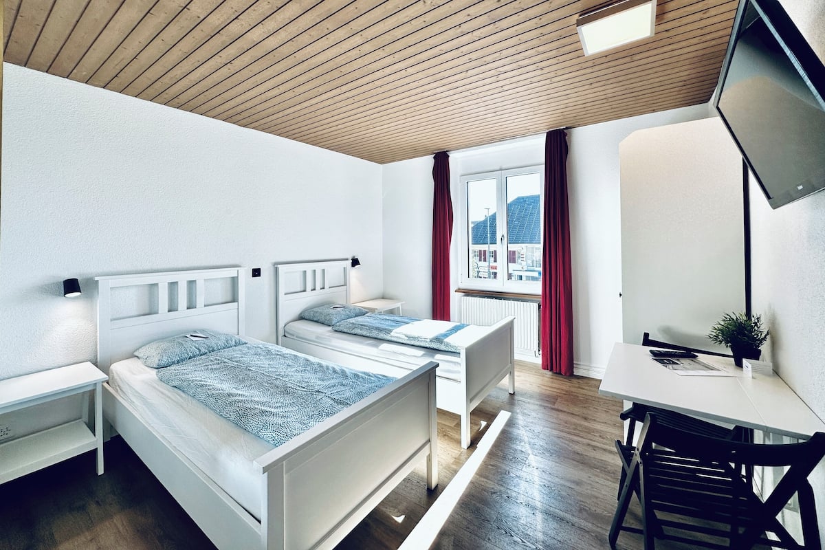 Desk, laptop workspace, free WiFi, bed sheets