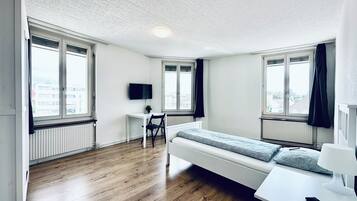 Desk, laptop workspace, free WiFi, bed sheets