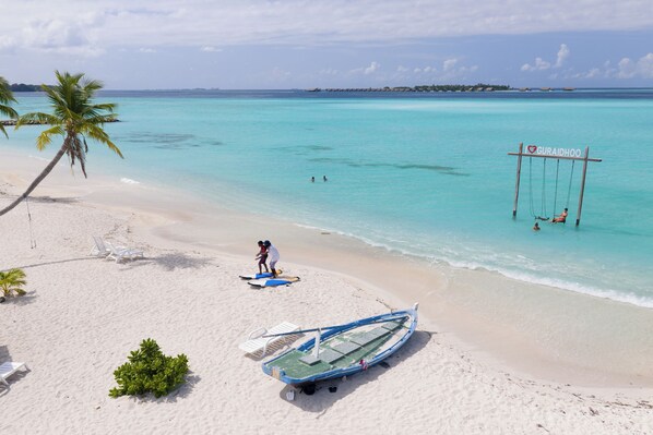 On the beach, white sand, free beach cabanas, sun-loungers