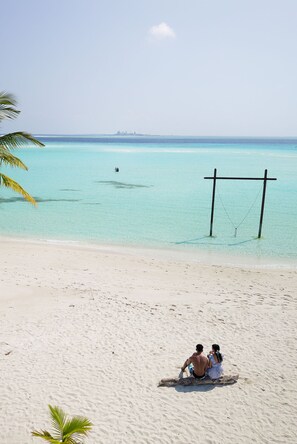 On the beach, white sand, free beach cabanas, sun-loungers