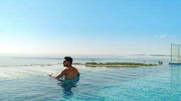 3 outdoor pools, open 7:00 AM to 9:00 PM, pool umbrellas, sun loungers