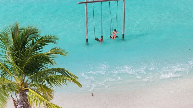 A beach with a swing set labeled "GURAIDHOO" and a palm tree. - h78 Guraidhoo (Guraidhoo)