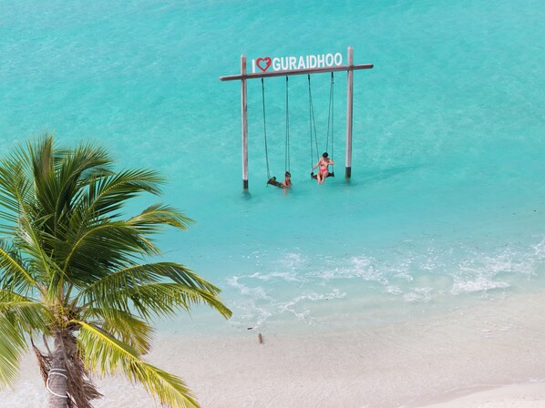 On the beach, white sand, free beach cabanas, sun loungers
